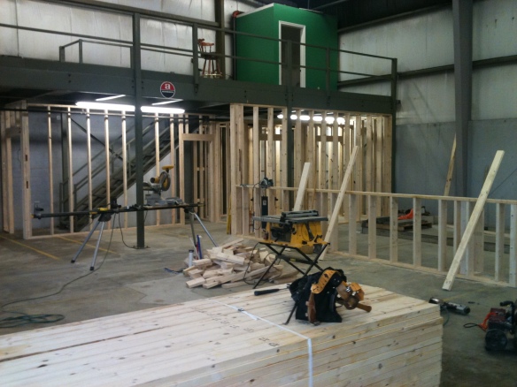 Framing the restrooms, hall and stairway. The low wall to the right will separate the tasting area from the brewery.